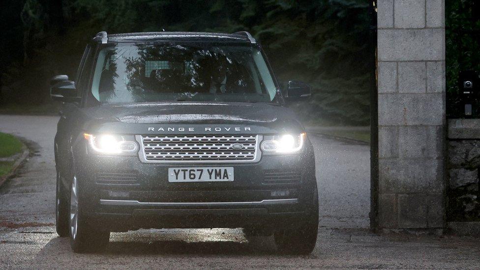 A Range Rover carrying Prince Harry, Duke of Sussex leaves Balmoral