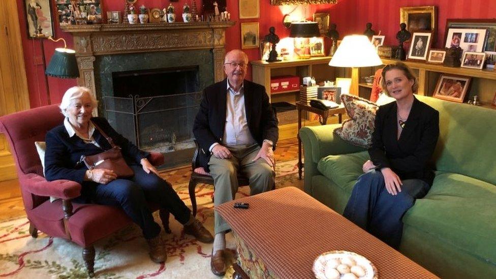 Princess Delphine (R) pictured with former King Albert (C) and his wife Paola (L)