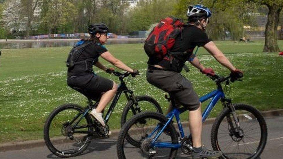 cycling through a park