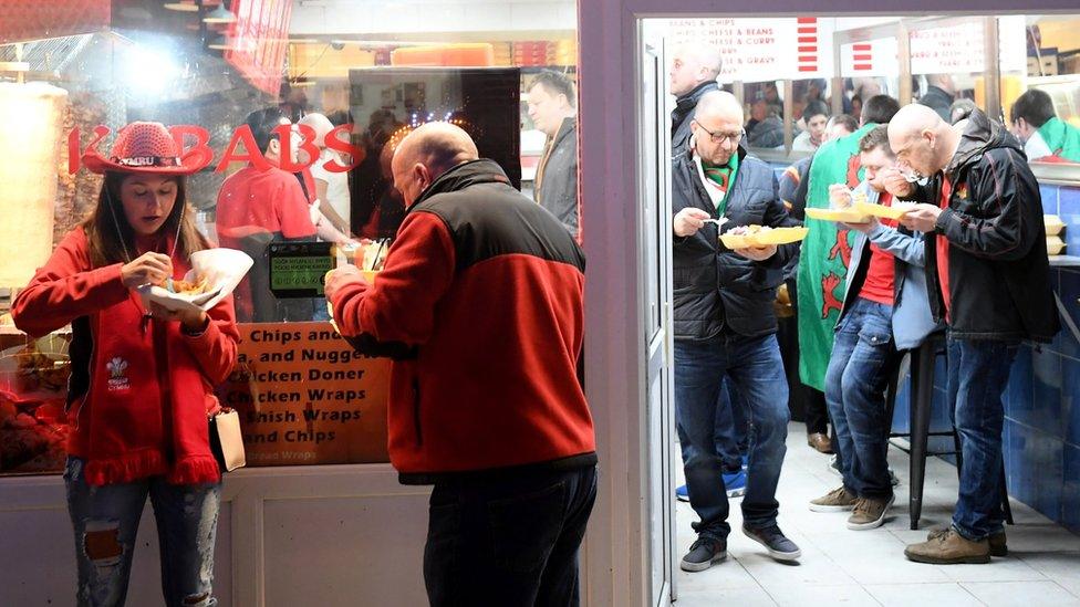 Rugby fans at a kebab shop in Cardiff city centre