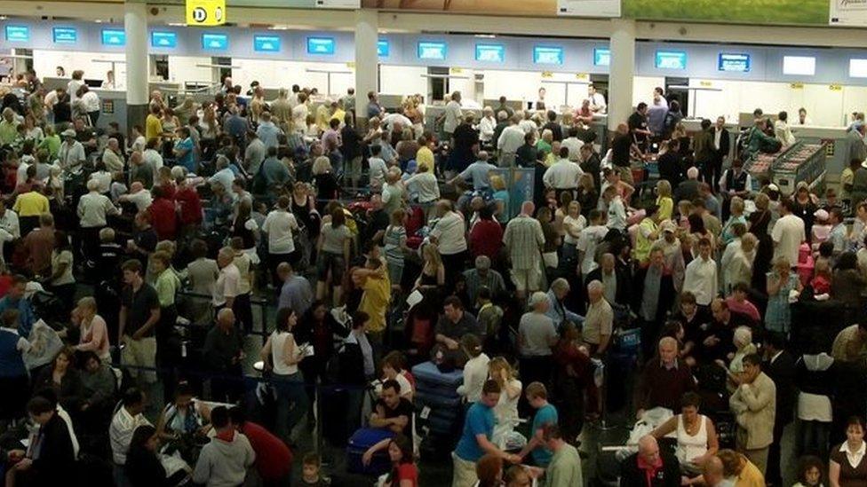 Passengers crowd the departure hall at Gatwick airport, London. Archive photo