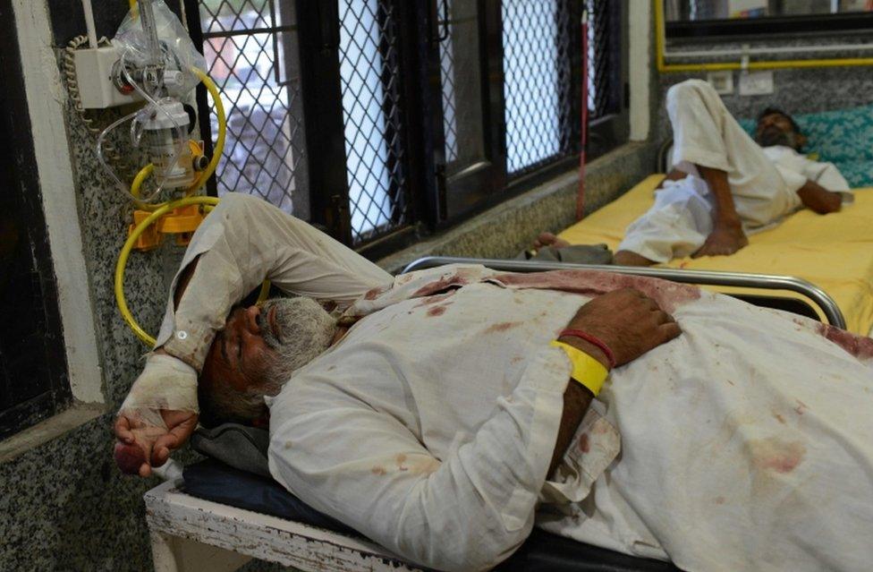 Injured followers of religious leader Gurmeet Ram Rahim Singh are seen after receiving treatment at the civil hospital in Panchkula on August 26, 2017