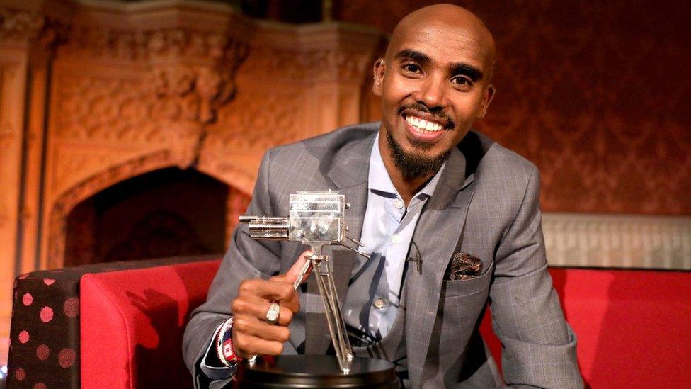 Sir Mo Farah holding SPOTY award