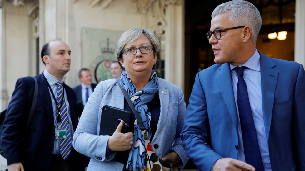 Scottish National Party (SNP) MP Joanna Cherry (C) and Jolyon "Jo" Maugham QC (R) leave the Supreme Court in central London, on the second day of the hearing into the decision by the government to prorogue parliament on September 18, 2019.