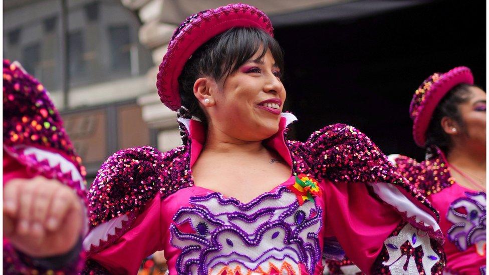 A performer in a pink sequined costume