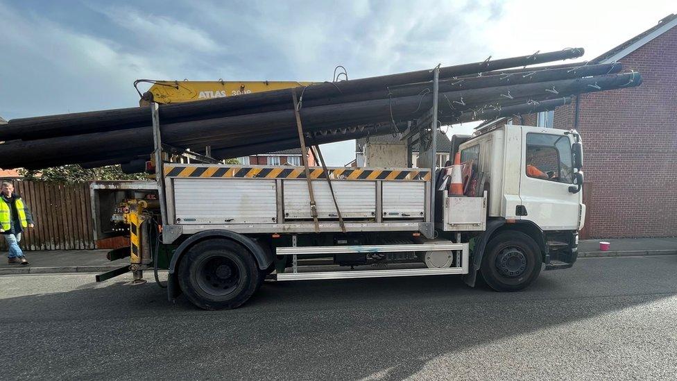 A lorry delivers poles to Hedon