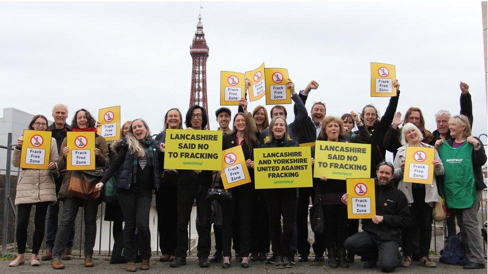 Greenpeace supporters celebrate their court victory