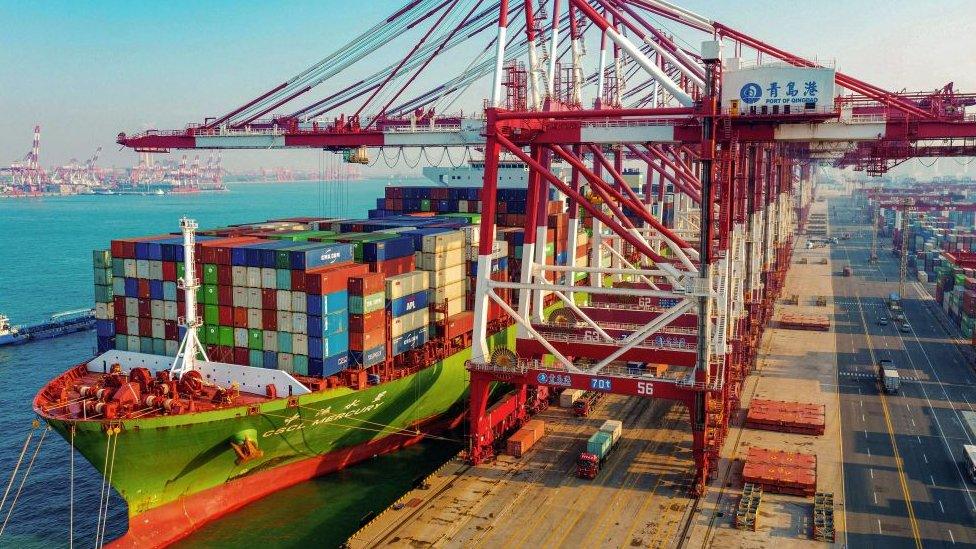 A cargo ship loaded with containers berths at a port in Qingdao in China's eastern Shandong province