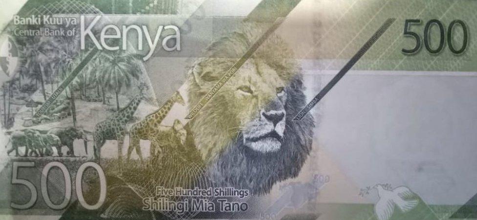 The banknote also shows a lion, giraffes and elephants