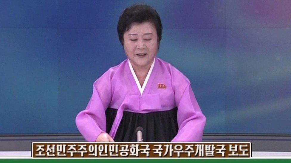 A North Korean newscaster making an announcement about North Korea's satellite launch