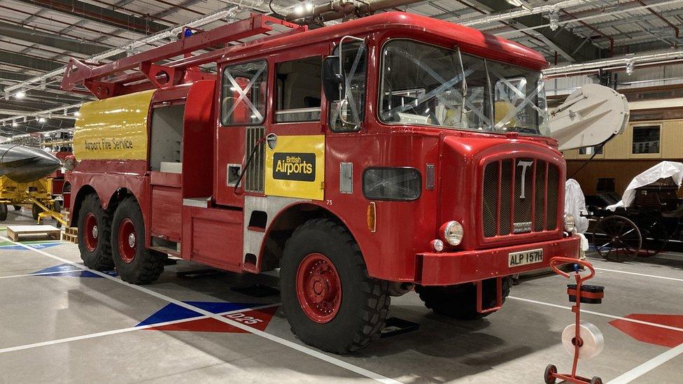 A vintage airport fire engine in red, with British Airports written on the door.