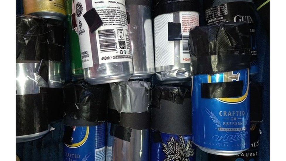 Beer cans with tiny holes