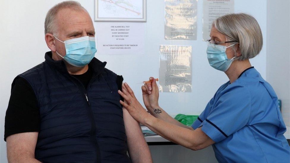 Gillian Bruce co-ordinator with the immunisation team at NHS Forth Valley gives a vaccine to Ian Love from Dunipace at Forth Valley College"s Stirling campus