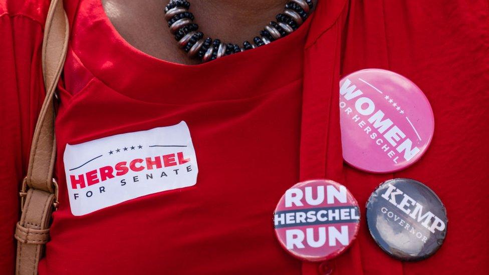 Woman wearing candidate pins