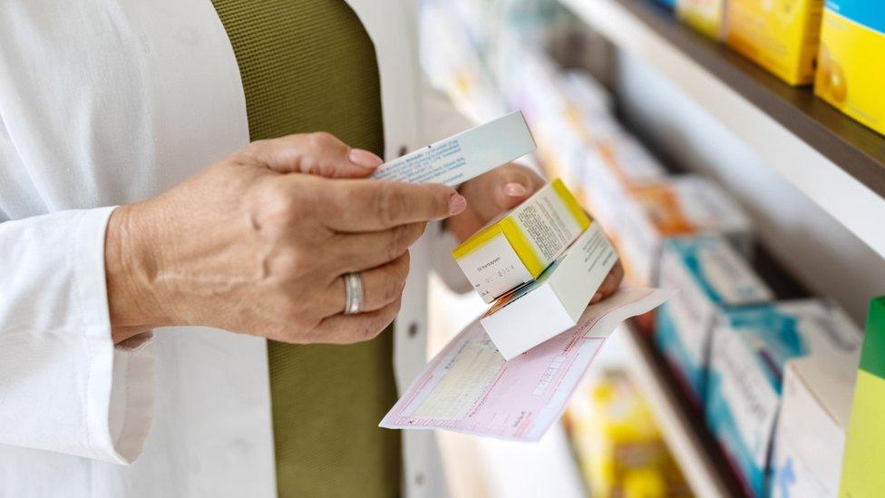 Pharmacist holding some medication