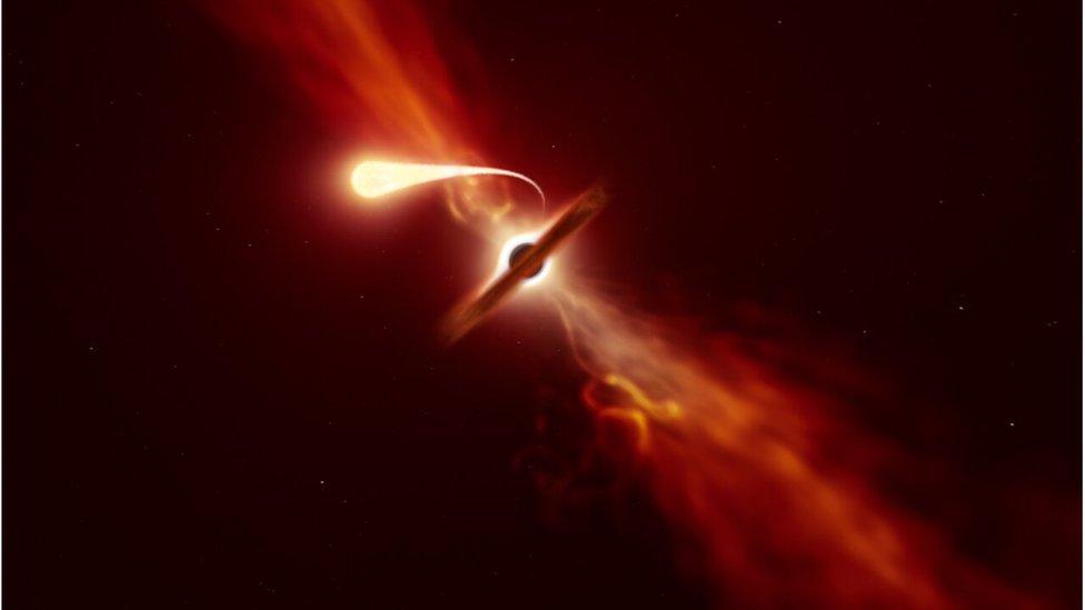 An artist's impression of a star being tidally disrupted by a supermassive black hole