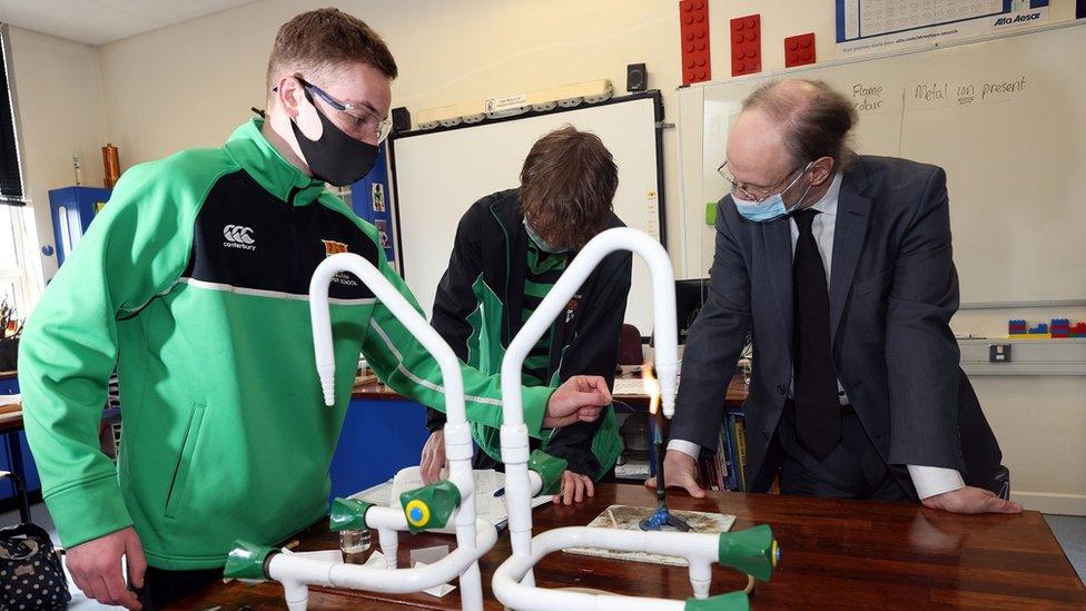 Peter Weird and students in school lab with masks