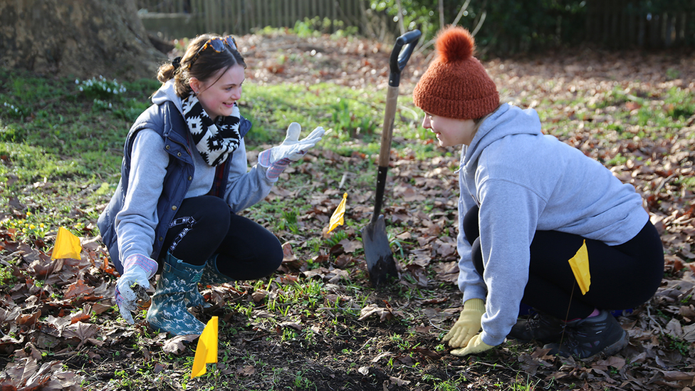 Students planting flowers