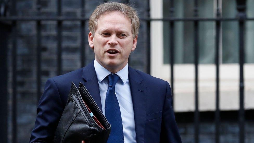 Britain"s Transport Secretary Grant Shapps leaves number 10, Downng Street in central London on March 17, 2020. - Britain stepped up its response to coronavirus, recommending household isolation, home-working and an end to mass gatherings to try to stem an accelerating outbreak.