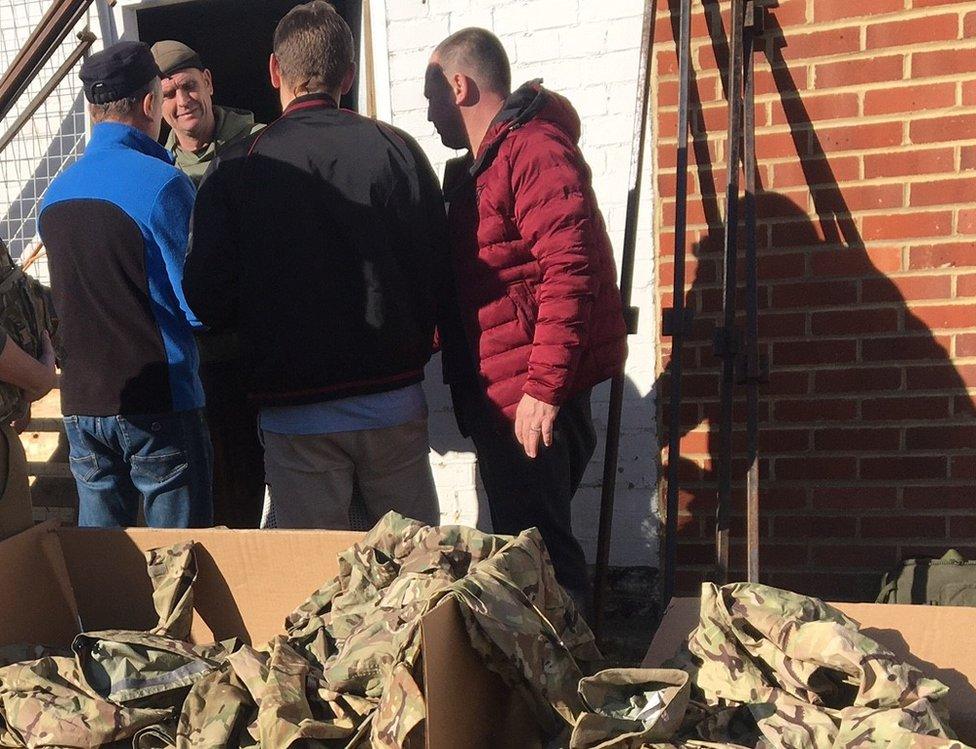 Ukrainians at army surplus store