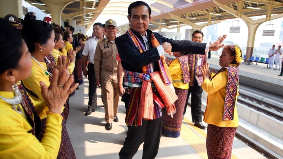 Thailand Prime Minister Prayuth Chan-ocha dances at a train station