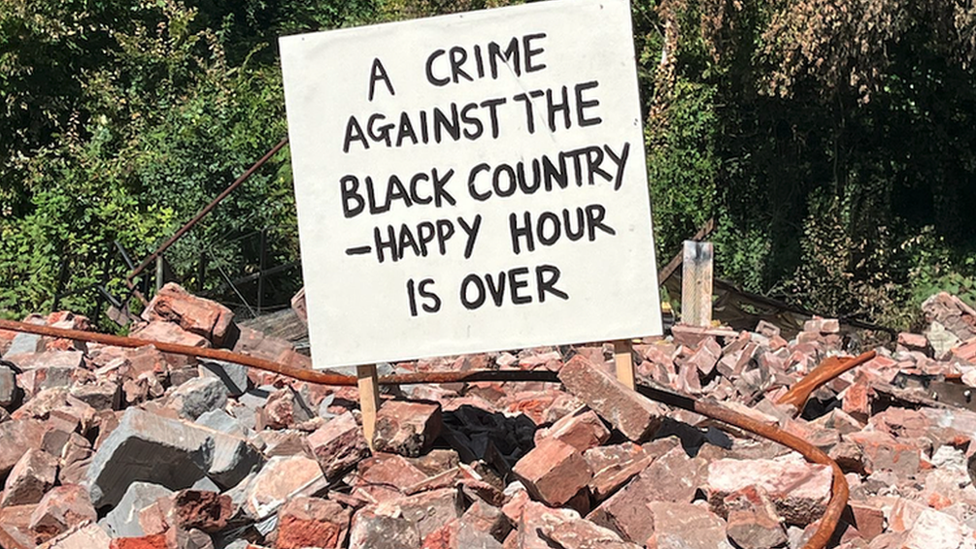 Sign saying "A crime against the Black Country - happy hour is over"