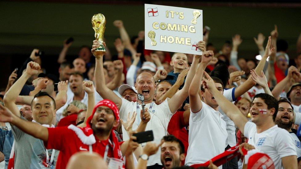 England fans celebrate after the game against Colombia