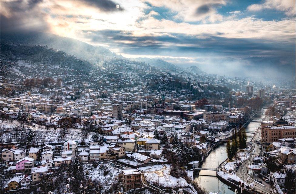 A city landscape covered in snow