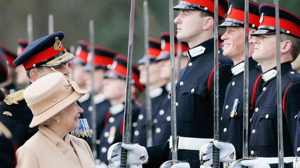 Queen Elizabeth II as proud grandmother smiles at Prince Harry as she inspects soldiers at their passing-out Sovereign's Parade at Sandhurst Military Academy on April 12, 2006