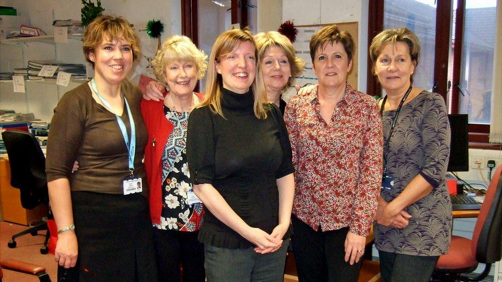 Adele Harman (centre) and her colleagues