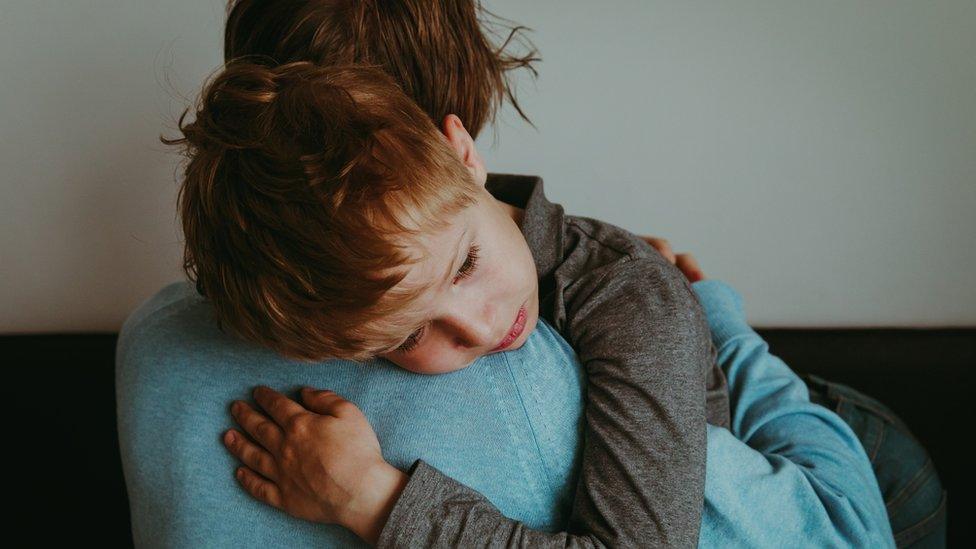 Child hugging mother