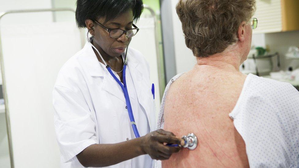 file picture - doctor examining lungs