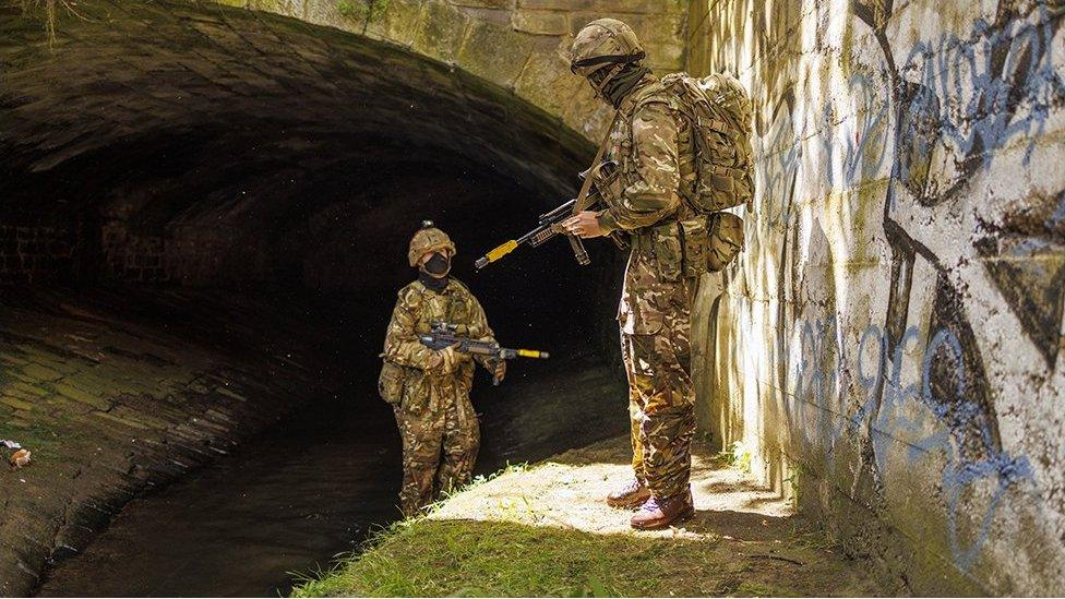 troops near tunnel entrance