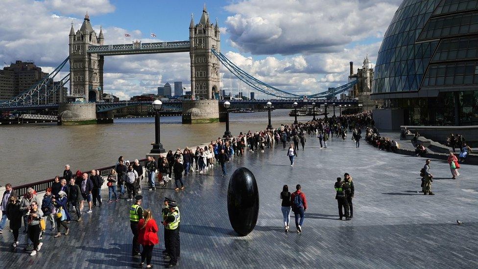 The queue passes Tower Bridge