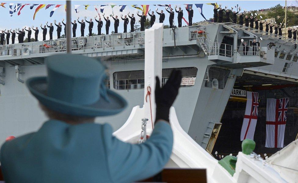 The Queen waves British Royal Navy crew members on HMS Bulwark in Valletta, Malta