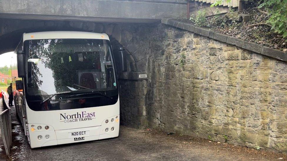 The coach lodged under the Green Lane Metro bridge