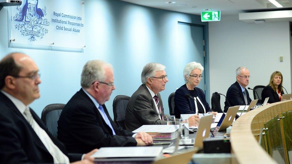 Justice Peter McClellan (3rd-L) gives his opening remarks at the beginning of the public hearings at the Royal Commission into Institutional Responses to Child Sexual Abuse in Sydney on September 16, 2013.