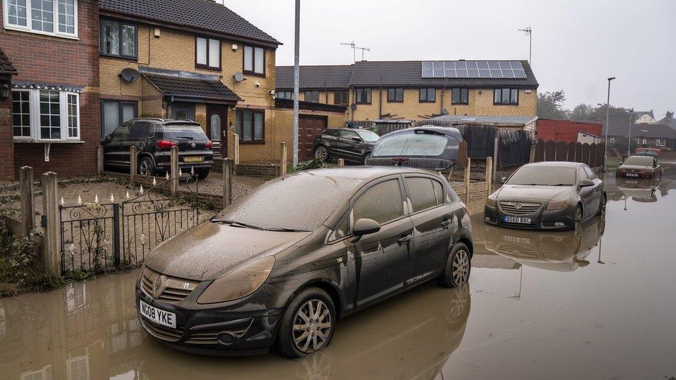 Flooding on a street in Catcliffe following Storm Babet