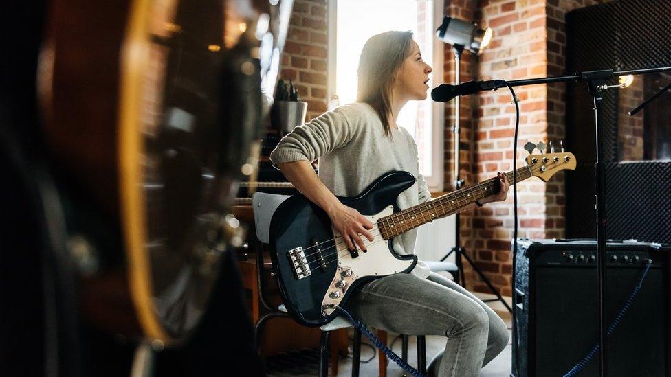 Woman playing guitar