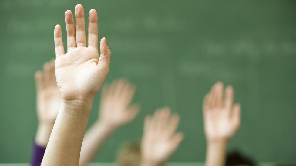 Hands up in classroom