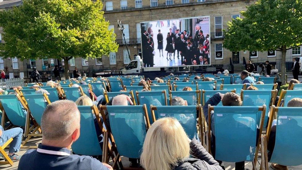 Crowds watching the funeral in Newcastle