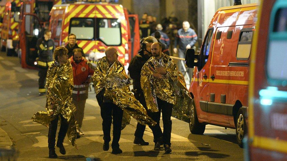 Survivors being led away on rue Oberkampf near the Bataclan concert hall in central Paris