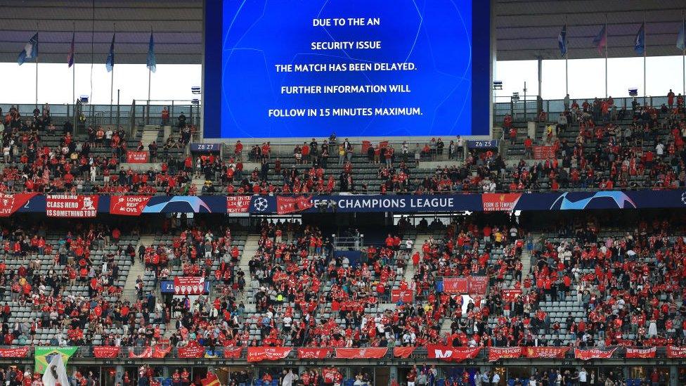 Sign warning of delay inside Stade de France