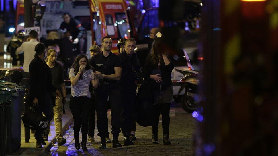 People are evacuated following an attack at the Bataclan concert venue in Paris, on November 13, 2015