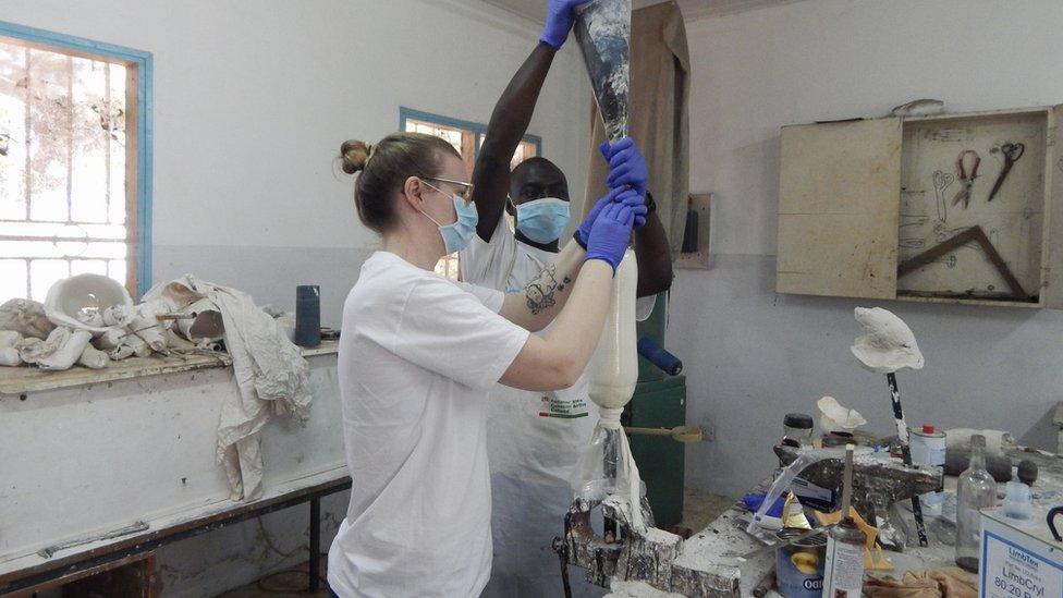 Bex Yearworth in a lab working on a prosthetic