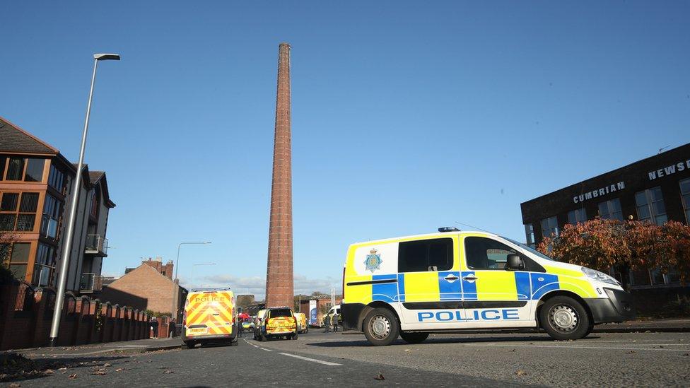 Police vehicles parked near Dixons Chimney