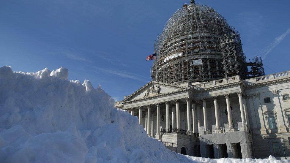 A pile of shovelled snow stands in the plaza on the east side of the Washington DC.