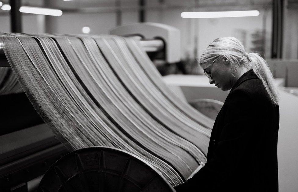 Siobhan Mackenzie looking at looms