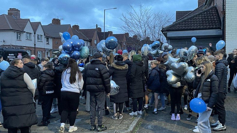 People holding balloons