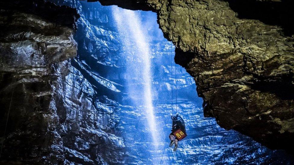 A potholer is winched into Gaping Gill